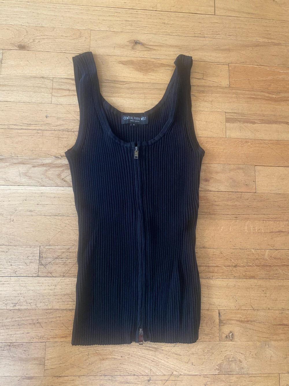 Central Park west black ribbed knit sleeveless sweater. Zip front. Size small
